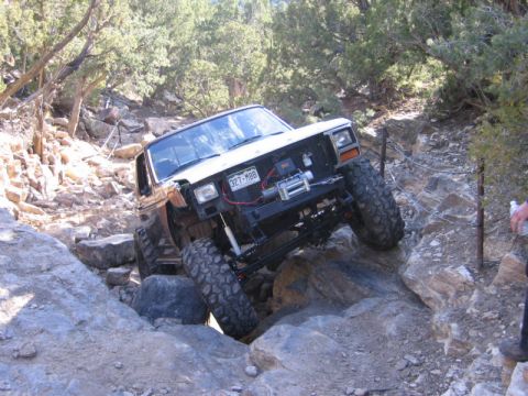 1981 Ford Bronco - This modified 1980s Ford Bronco navigates a challenging rocky trail, its off-road capabilities.
