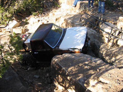 1981 Ford Bronco - This 1981 Ford Bronco is wedged between large rocks on a steep, off-road path.