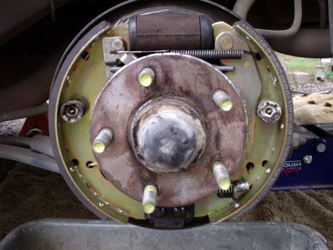 2000 Ford Taurus - Close-up view of a rear drum brake assembly, showing the brake cylinder, springs, and brake shoes.