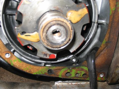 1997 Yamaha YT60 Tri-Moto - Close-up of an engine component with visible sealant and gasket material.