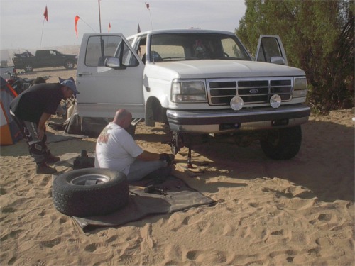 Me assesing the damage on my now broken bronco. The inner snap-ring was the only thing holding the wheel on. The calipers are the floating type.