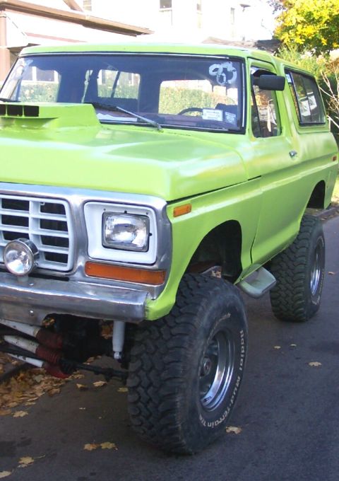 1978 Ford Bronco - This lifted 1978 Ford Bronco features a prominent hood scoop and a vibrant lime green paint job.