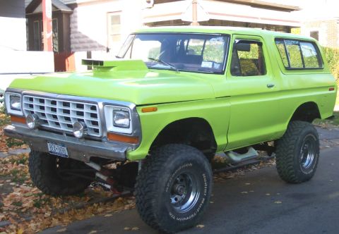 1978 Ford Bronco - This lifted 1978 Ford Bronco features a prominent hood scoop and aggressive off-road tires.