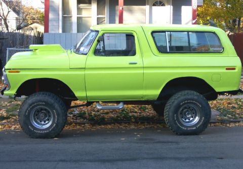 1978 Ford Bronco - This lifted 1978 Ford Bronco features a prominent hood scoop and custom lime green paint.