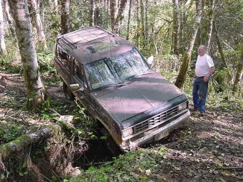 1987 Ford Bronco II - 10/22/05 had to be winched out of this hole....thats my dad LHAO