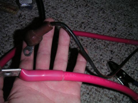 1994 Ford Bronco - New charge cable next to stock one. Big difference.