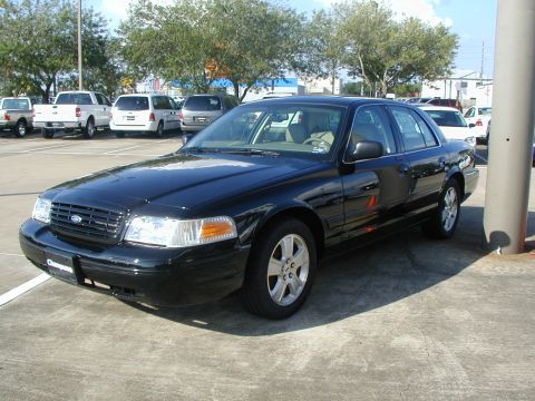2000 Ford Crown Victoria - This black 2000 Ford Crown Victoria is shown from a 3/4 front angle.