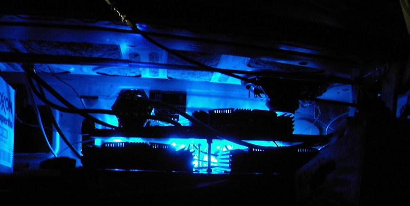 Underbody neon lights with visible wiring and a box labeled 'OXON'