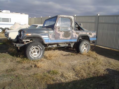 1981 Ford Bronco - CJ8 with no engine tranny in the bed and T case in the cab.