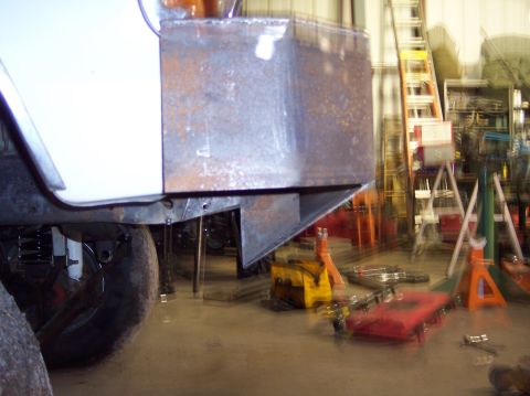 1979 Ford Bronco - Custom bumper fabrication in progress, showing raw steel and workshop equipment.