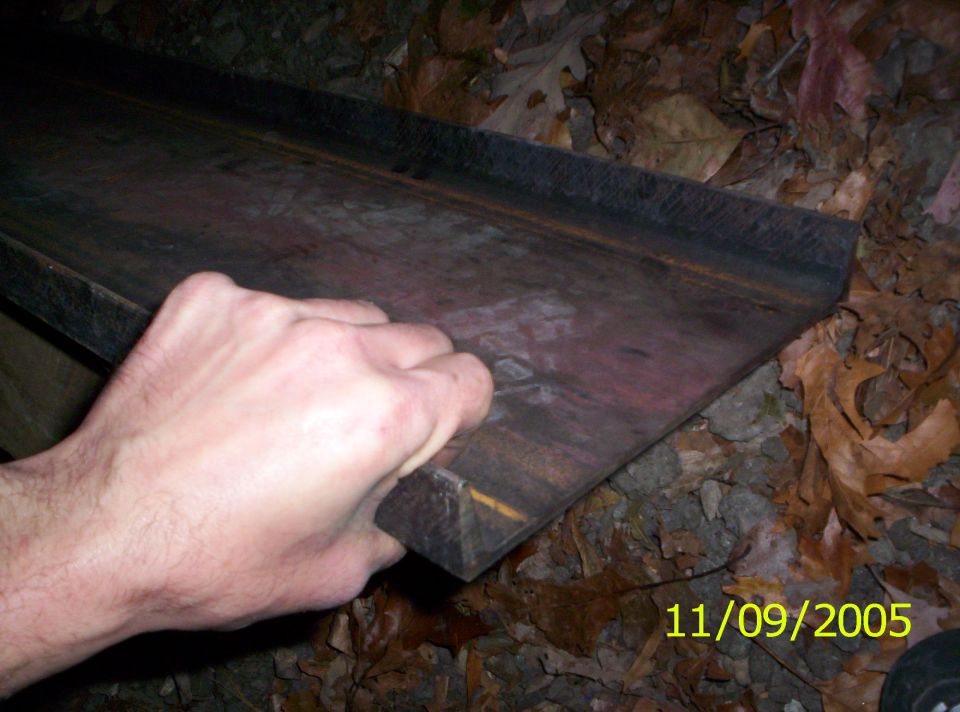 Metal part with hand, 11/09/2005 Supermotors.net watermark