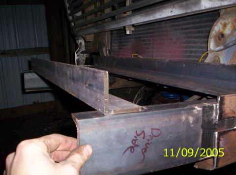 1985 Ford Bronco - A close-up view of metal fabrication work on the front of a vehicle, with the radiator visible.