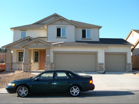 1995 Ford Taurus - In front of my new home, almost done 7-31-05