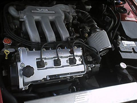 1996 Ford Probe - Close-up view of a Mazda V6 engine bay, showing the intake and valve cover.