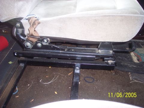 1976 Ford F-150 - The seat bracket and slider mechanism are visible in this close-up shot.