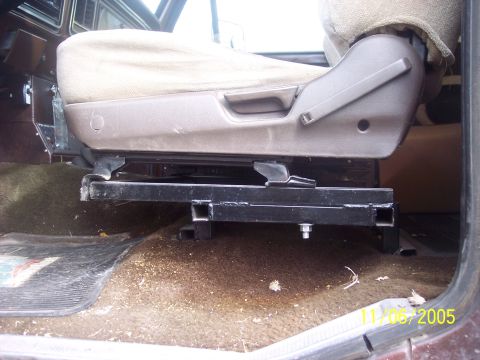 1976 Ford F-150 - A custom seat bracket is visible beneath the driver's seat, attached to the vehicle floor.