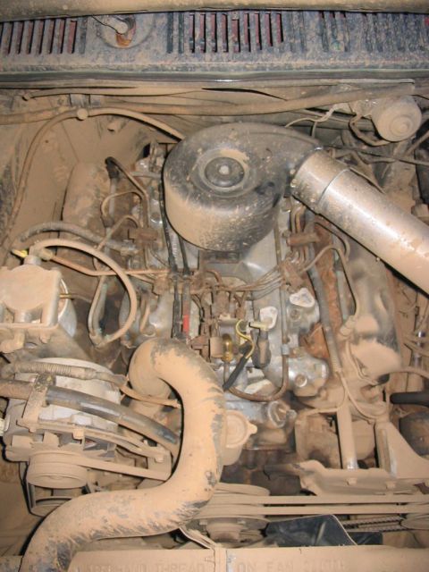 1985 Ford F-350 - The engine bay of a 1985 Ford F-350, a diesel engine with a prominent air intake system.