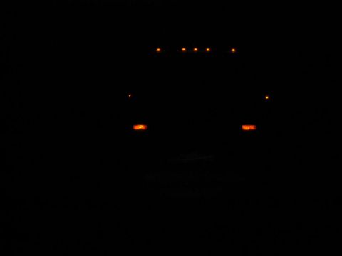 1985 Ford F-350 - Truck front with illuminated marker lights on the roof and above the headlights.