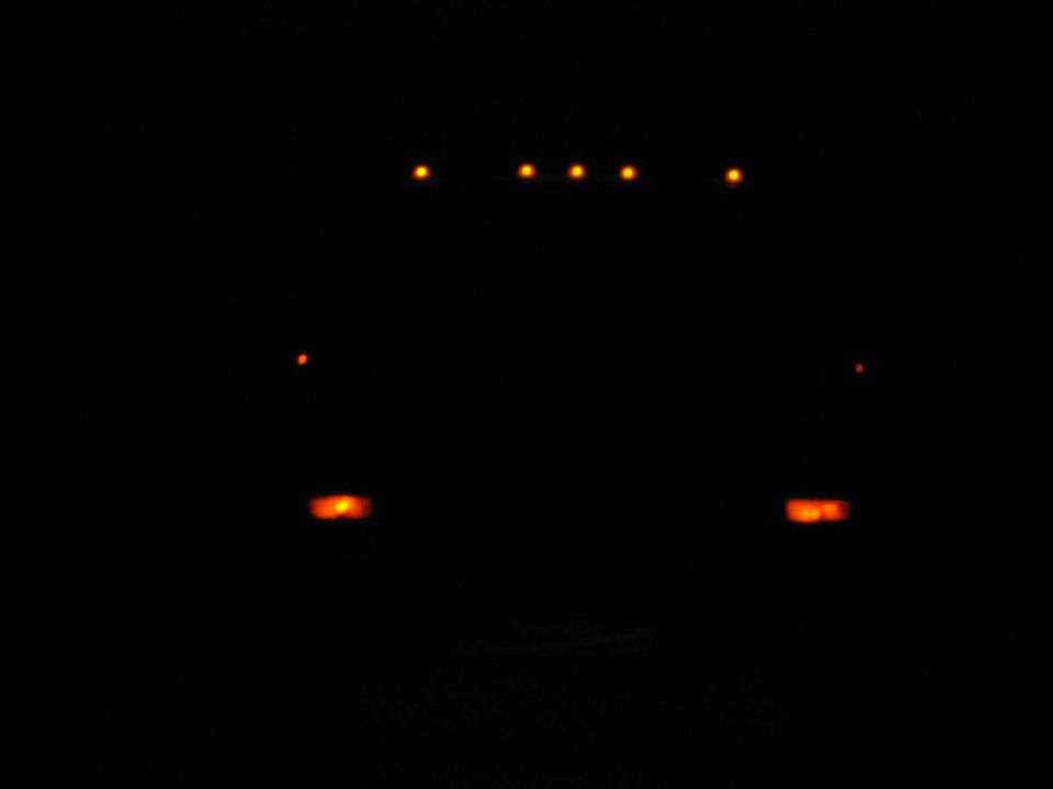 1985 Ford F-350 cab marker lights illuminated at night