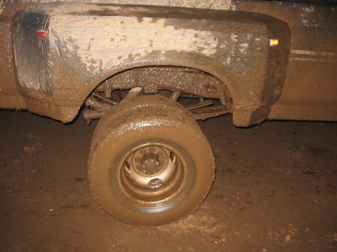 1985 Ford F-350 - Muddy 1985 Ford F-350 front wheel and fender after off-roading.