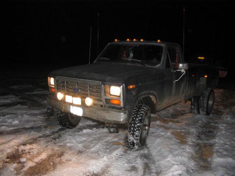 1985 Ford F-350 - This truck appears to be a Ford F-Series from the early 1980s, seen in a snowy environment at night.