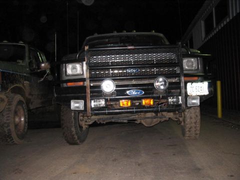 1985 Ford F-350 - Frontal view of a modified Ford F-Series truck, parked next to another vehicle.