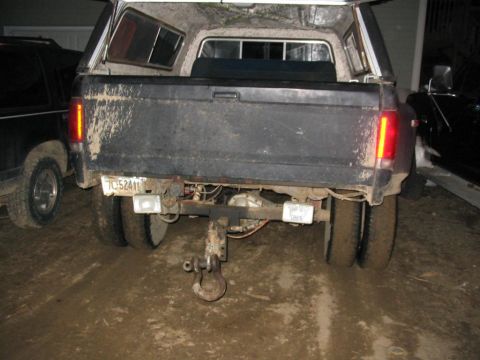 1985 Ford F-350 - The truck has a tow hitch and dual rear wheels, suggesting it's a heavy-duty model.