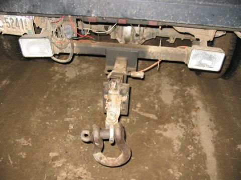 1985 Ford F-350 - The rear of a truck shows a trailer hitch and license plate.