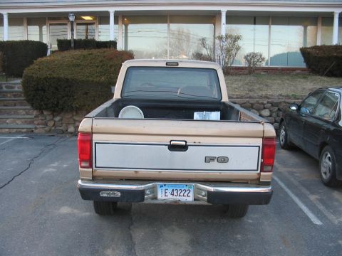 1988 Ford Ranger - This 1988 Ford Ranger pickup truck is seen from the rear, a silver tailgate insert and a license plate from Connecticut.