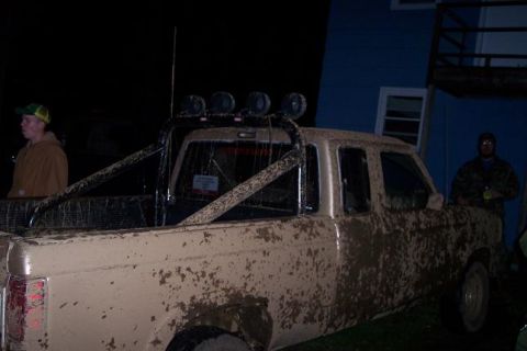 1988 Ford Ranger - This pickup truck is heavily covered in mud, suggesting it has been used off-road.
