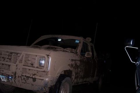 1988 Ford Ranger - This 1988 Ford Ranger is heavily covered in mud, obscuring most details but the grille is still visible.