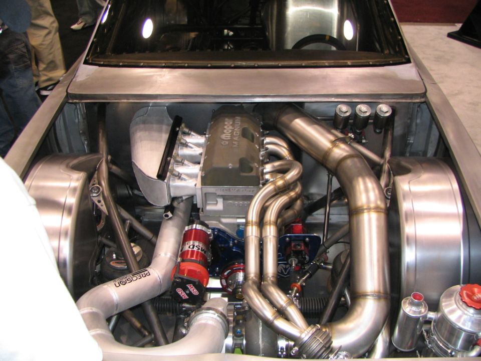 Custom V8 engine with Mopar Magnum branding, turbo plumbing, and MSD ignition components