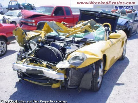 1996 Ford Probe - Multiple vehicles involved in a severe collision, with a yellow sports car showing extensive front-end damage.