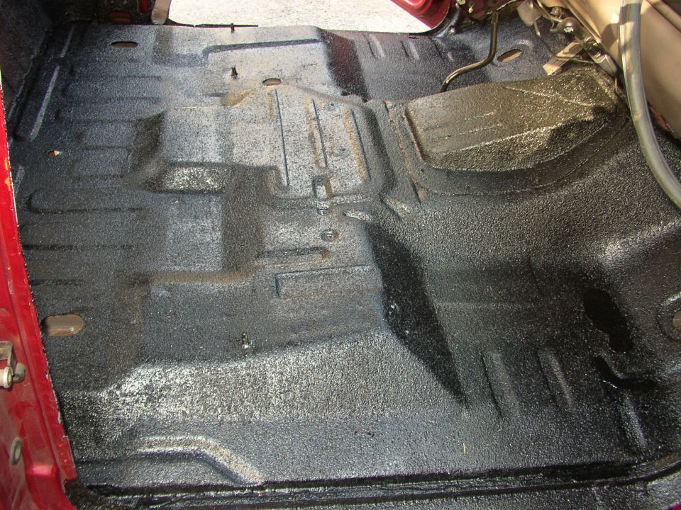 Interior floor coated with black spray-on liner