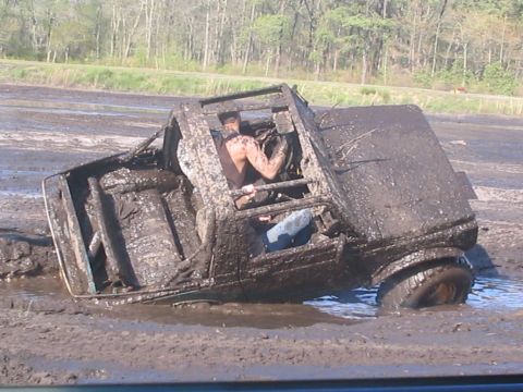 1987 Suzuki Samurai - Driver stuck in a 1987 Suzuki Samurai during a mud bogging event.