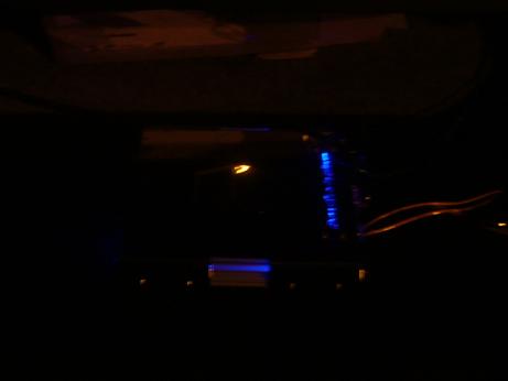 1992 Ford Crown Victoria - Aftermarket stereo installed in a car interior, illuminated with blue lights.