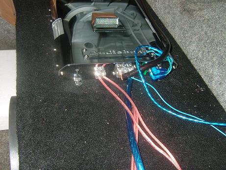 1992 Ford Crown Victoria - Close-up of car amplifier wiring, showing connections and colored cables.
