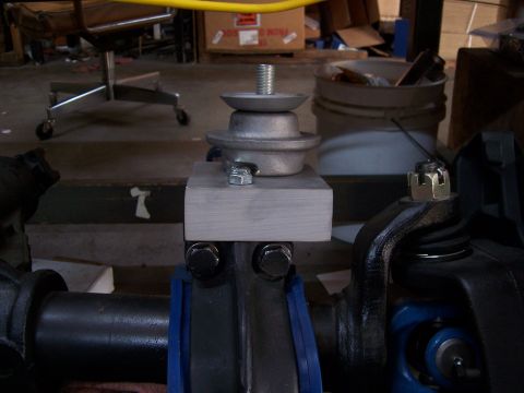 1983 Ford Bronco - Close-up view of a TTB spring adapter mount, showing its bolted assembly.