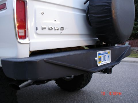 1979 Ford Bronco - Rear view of a 1979 Ford Bronco showing the spare tire and custom bumper.