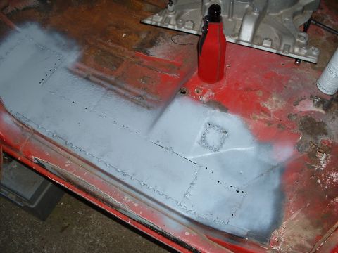 1978 Ford Bronco - Floor pan repair in progress, showing patched and primed sections.