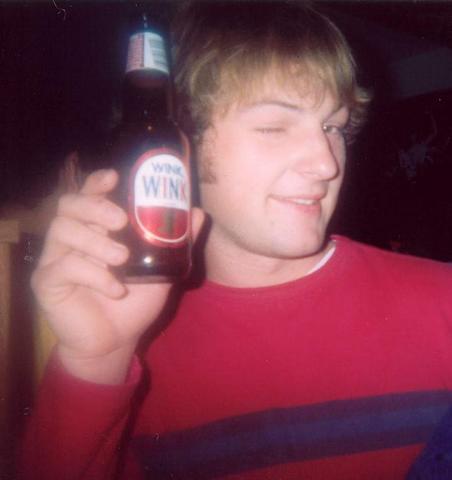 1995 Ford Bronco - Man holding a bottle of Wink soda and winking at the camera.