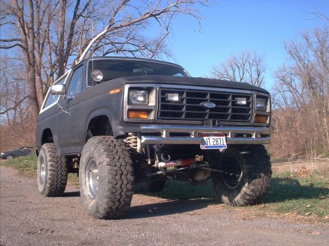 1986 Ford Bronco - This lifted Ford Bronco features a prominent grille and off-road tires, suggesting an earlier model year than claimed.