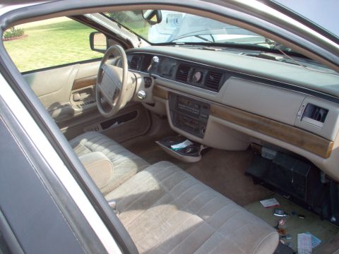 1994 Ford Crown Victoria - With the kick panels & knee bolster removed, the steering shaft bolt, column brace nut, & lower dash fasteners can be removed. Pull the A-p…