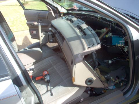 1994 Ford Crown Victoria - There's no need to disconnect the wiring or vacuum lines on the driver's side since this provides enough access to work. With the hoses & 3…