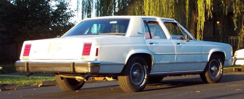 1985 Ford Crown Victoria LTD - Rear view of a 1985 Ford Crown Victoria LTD sedan parked on a street.