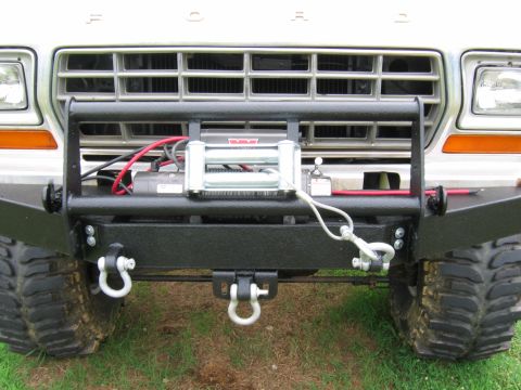 1992 Ford Mustang - This 1979 Ford truck features a heavy-duty aftermarket bumper with a winch and tow hooks.