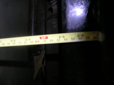 2001 Jeep Wrangler - A yellow tape measure is shown against a dark background, with markings indicating measurements in inches and centimeters.