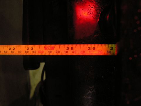 2001 Jeep Wrangler - Tape measure reads approximately 25 inches on a dark surface with red light.