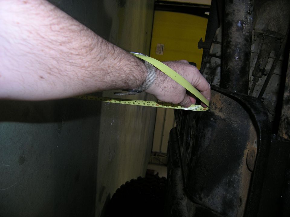 Measuring a vehicle part with a tape measure
