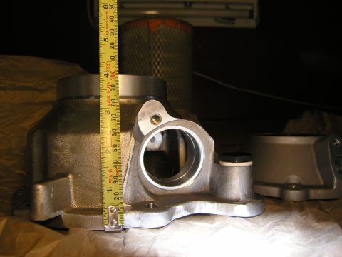2001 Jeep Wrangler - Automotive part measured with a tape measure, with an air filter in the background.